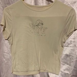 Cream angle crop top size small that is not a stain just lighting